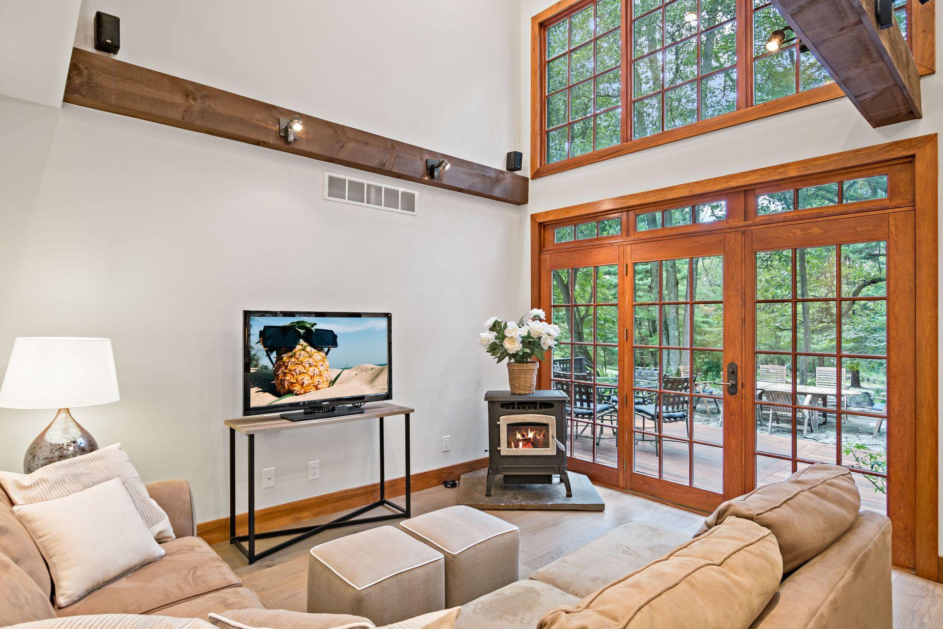 111 Old Kingdom Road Wilton, CT 06897 - Photo 13 of 57 a living room with furniture a rug and a painting on the wall