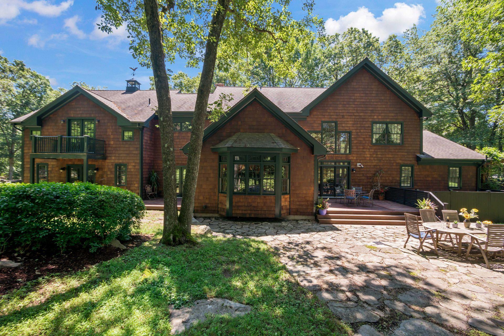 111 Old Kingdom Road Wilton, CT 06897 - Photo 2 of 57 a front view of a house with a yard