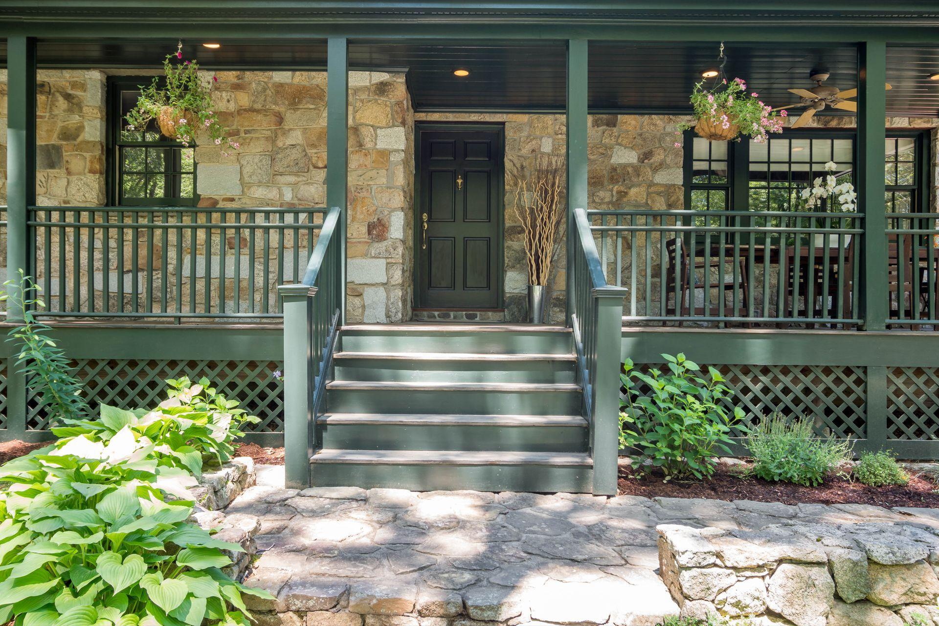 111 Old Kingdom Road Wilton, CT 06897 - Photo 3 of 57 a front view of a house with a porch