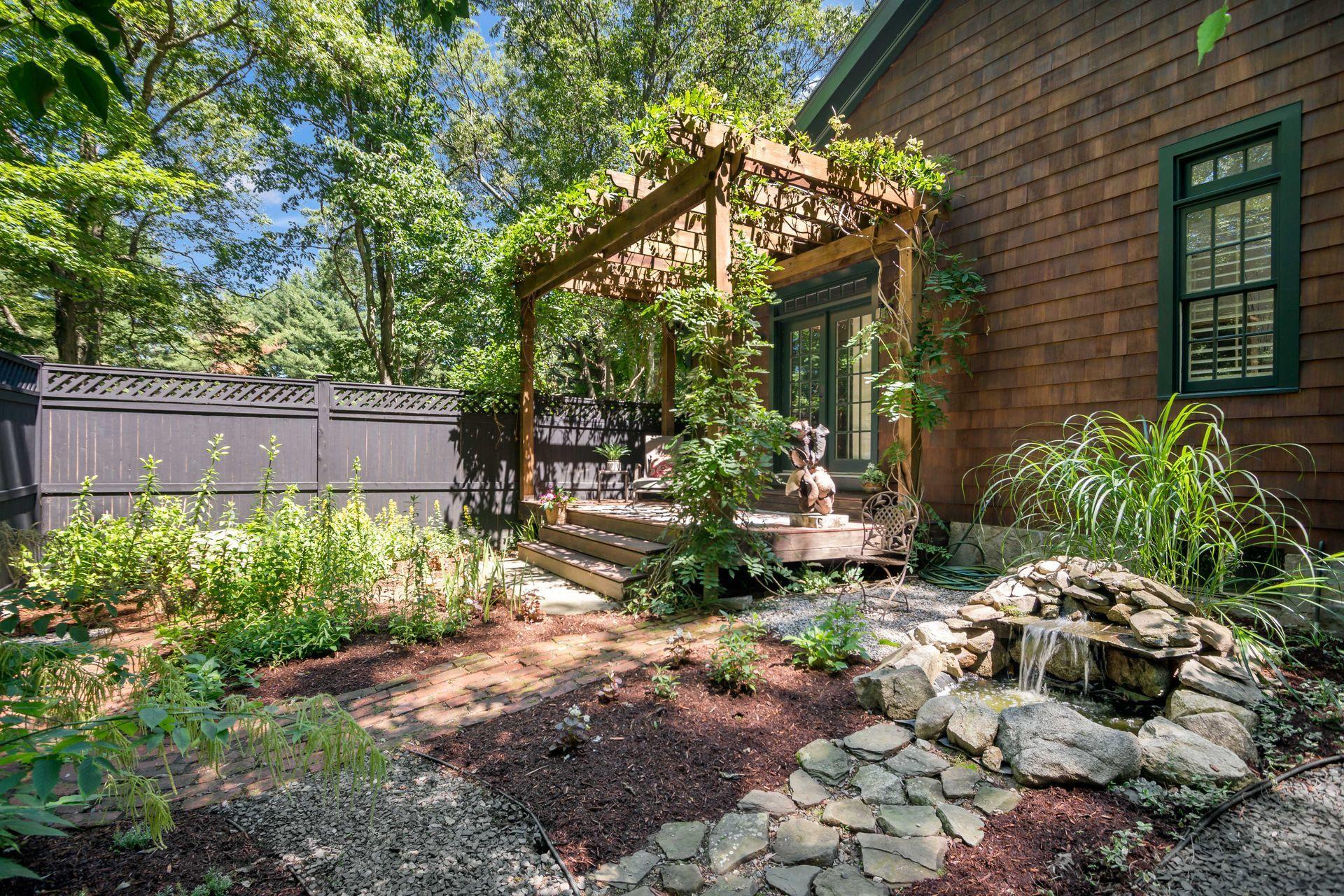 111 Old Kingdom Road Wilton, CT 06897 - Photo 34 of 57 a backyard of a house with lots of green space