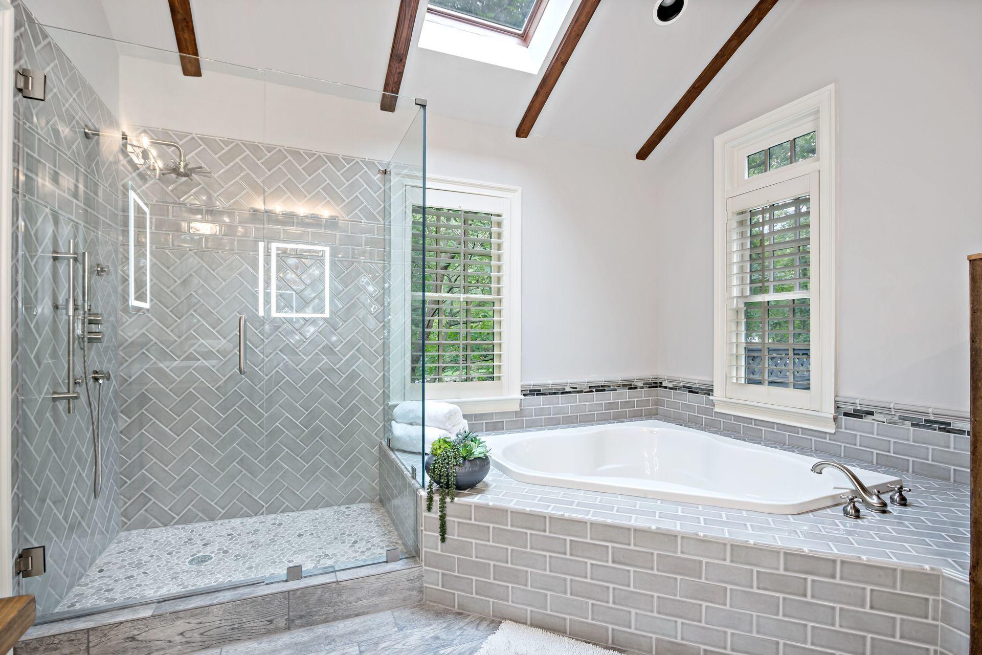 111 Old Kingdom Road Wilton, CT 06897 - Photo 37 of 57 a bathroom with a granite countertop bathtub and shower