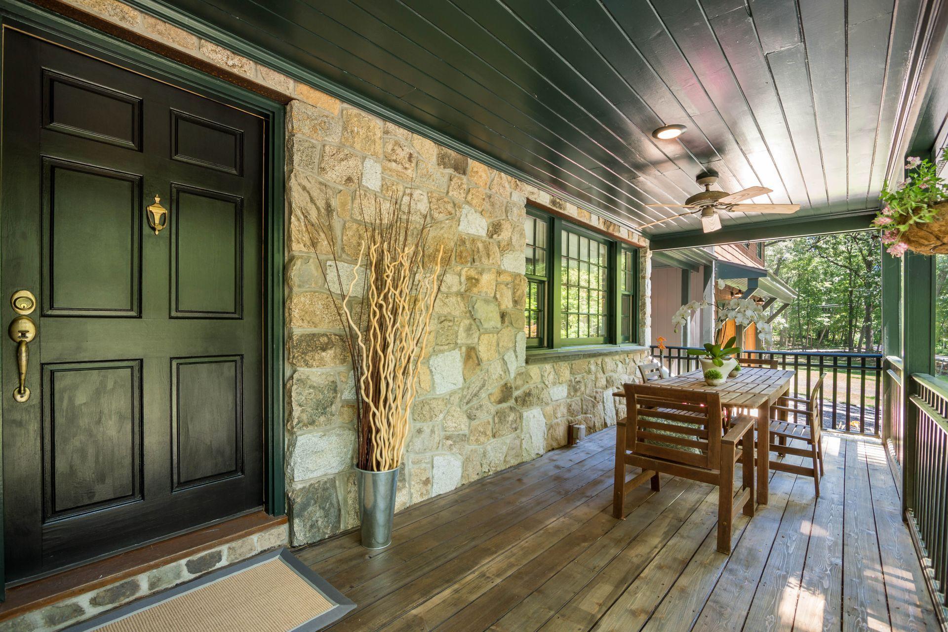 111 Old Kingdom Road Wilton, CT 06897 - Photo 4 of 57 a view of a porch with furniture and wooden floor