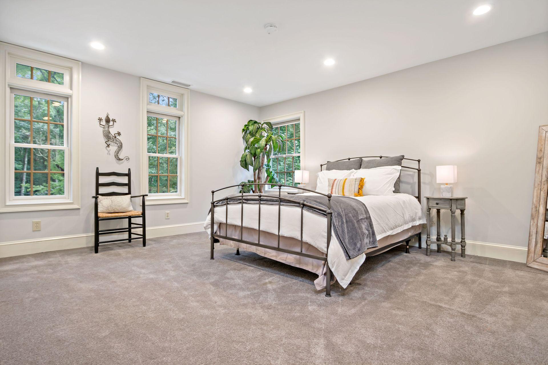 111 Old Kingdom Road Wilton, CT 06897 - Photo 43 of 57 a bed sitting in a spacious bedroom next to a window