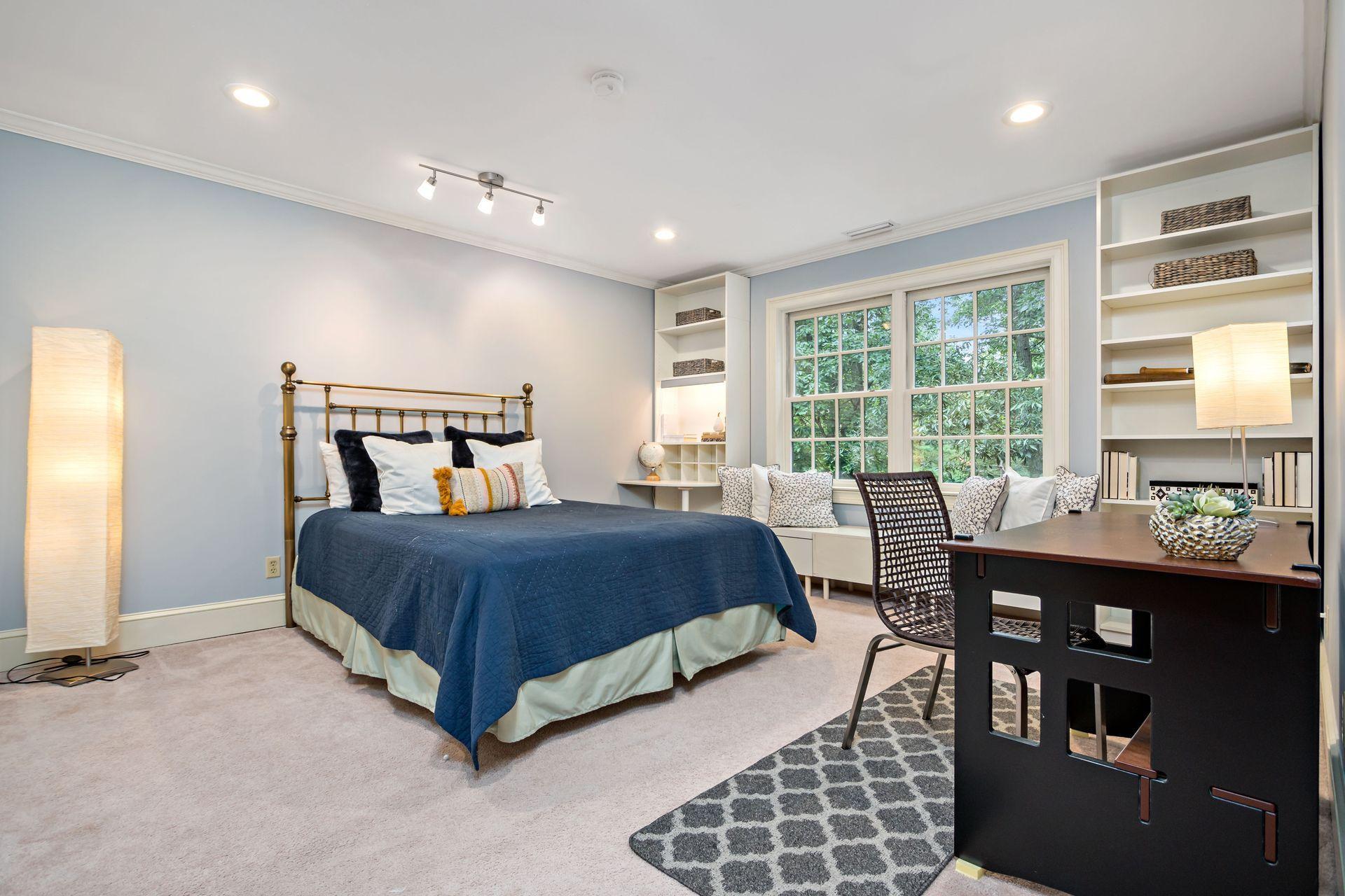 111 Old Kingdom Road Wilton, CT 06897 - Photo 45 of 57 a bedroom with a bed and wooden floor