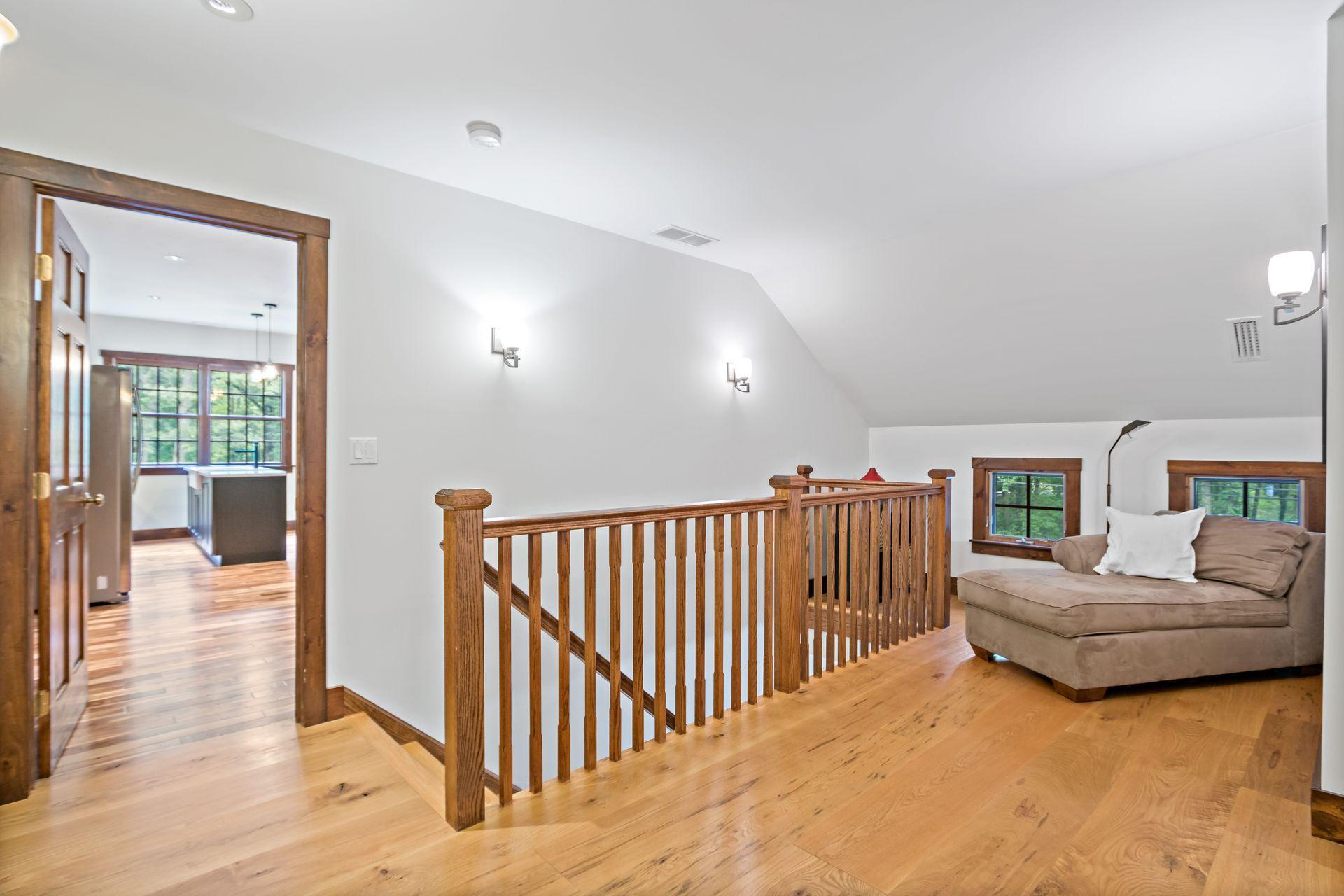 111 Old Kingdom Road Wilton, CT 06897 - Photo 48 of 57 a bedroom with furniture and a wooden floor