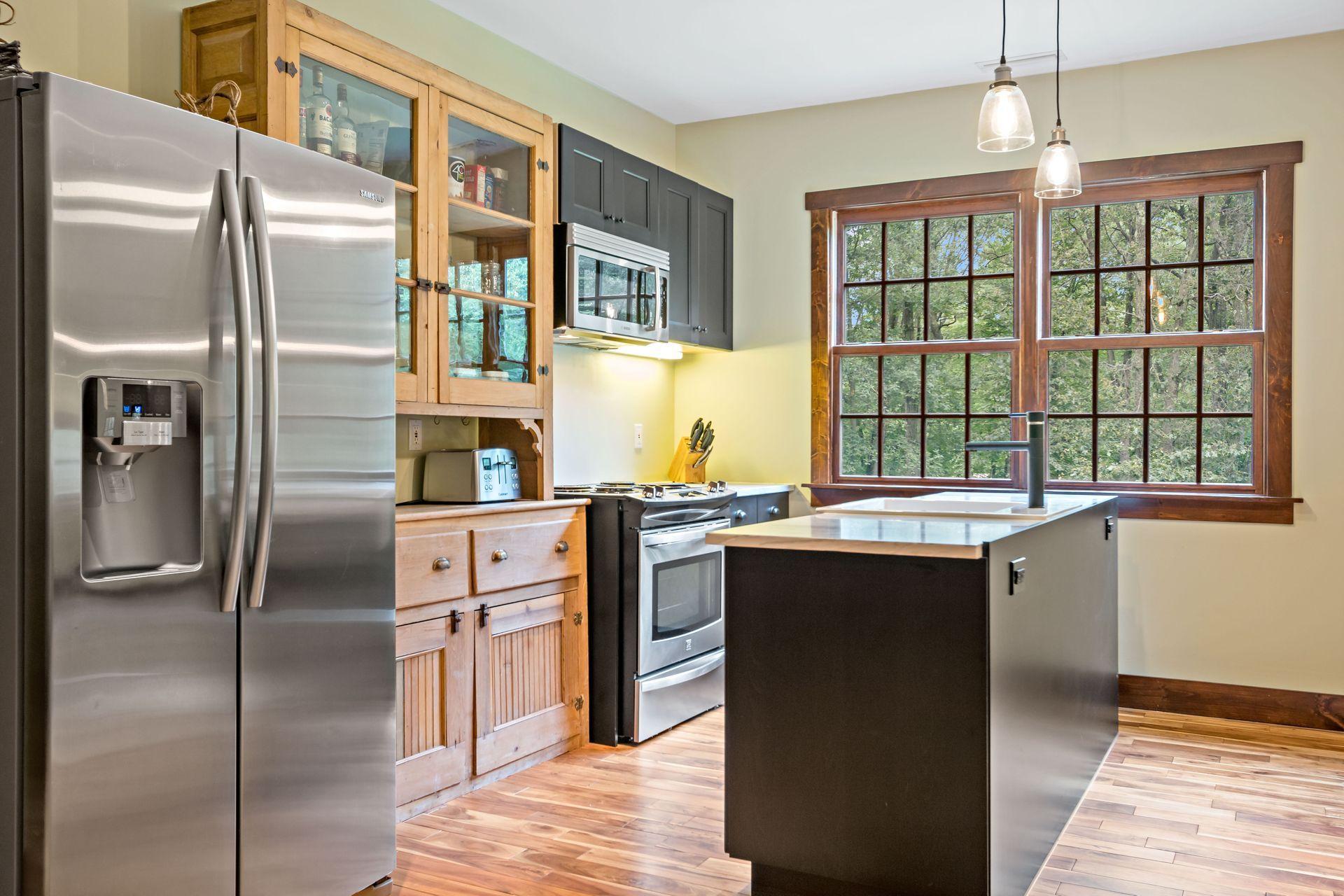 111 Old Kingdom Road Wilton, CT 06897 - Photo 51 of 57 a kitchen with stainless steel appliances granite countertop a refrigerator a sink a stove and oven
