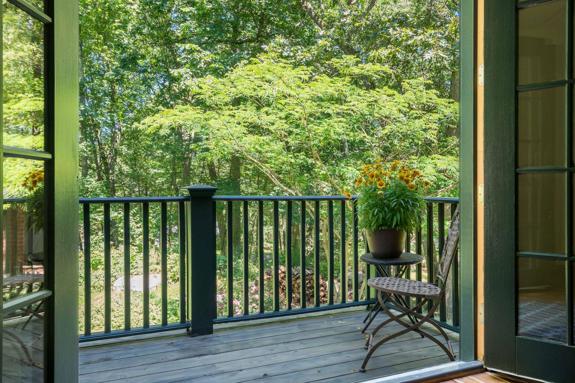 111 Old Kingdom Road Wilton, CT 06897 - Photo 53 of 57 a view of a balcony with chair and wooden floor