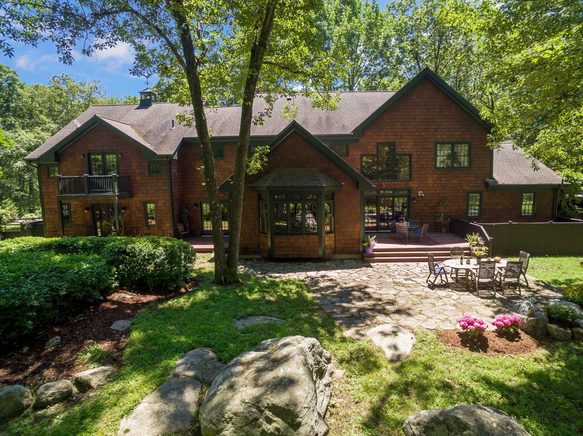 111 Old Kingdom Road Wilton, CT 06897 - Photo 55 of 57 a front view of a house with a yard