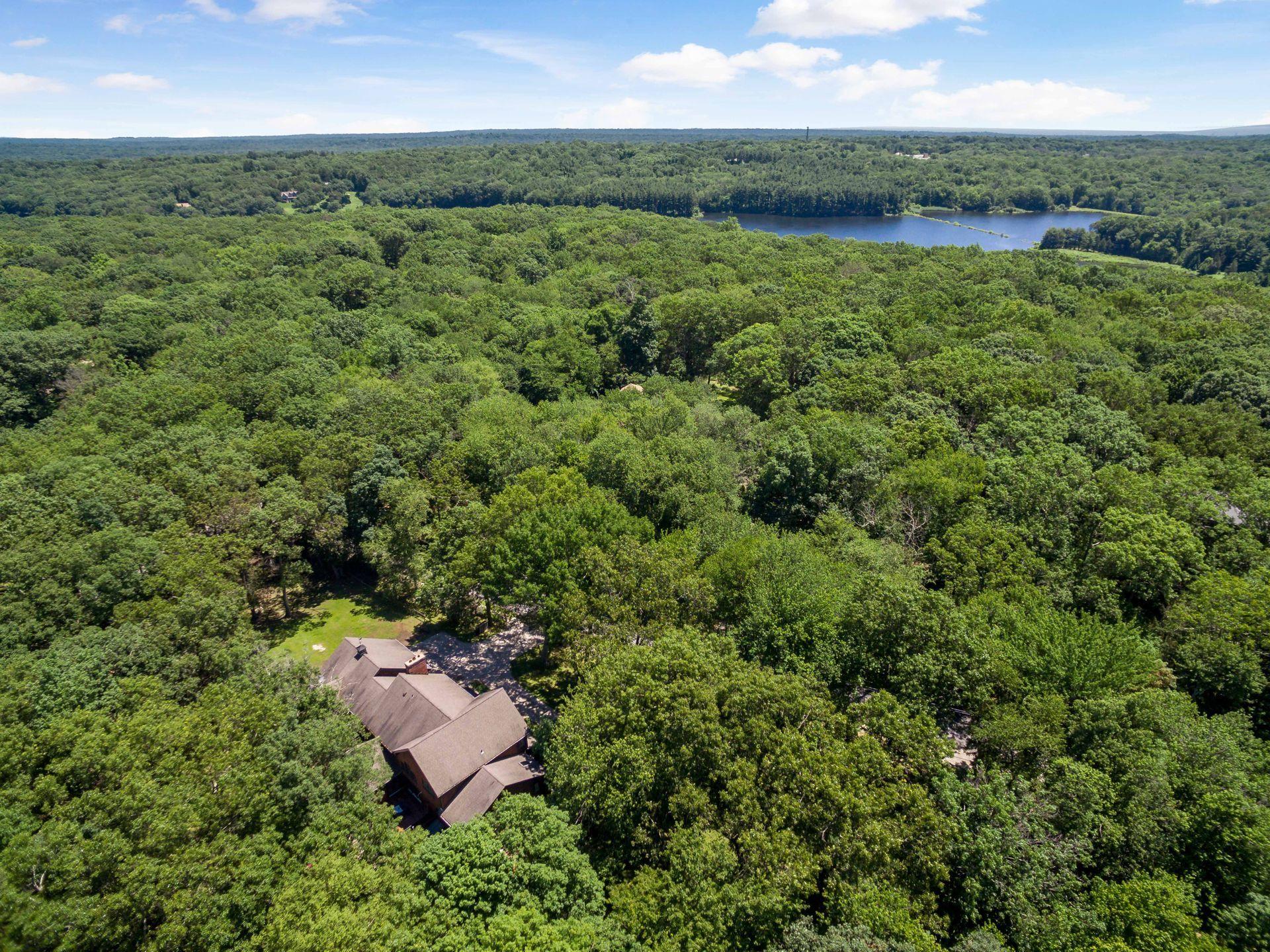 111 Old Kingdom Road Wilton, CT 06897 - Photo 57 of 57 an aerial view of a house with a yard
