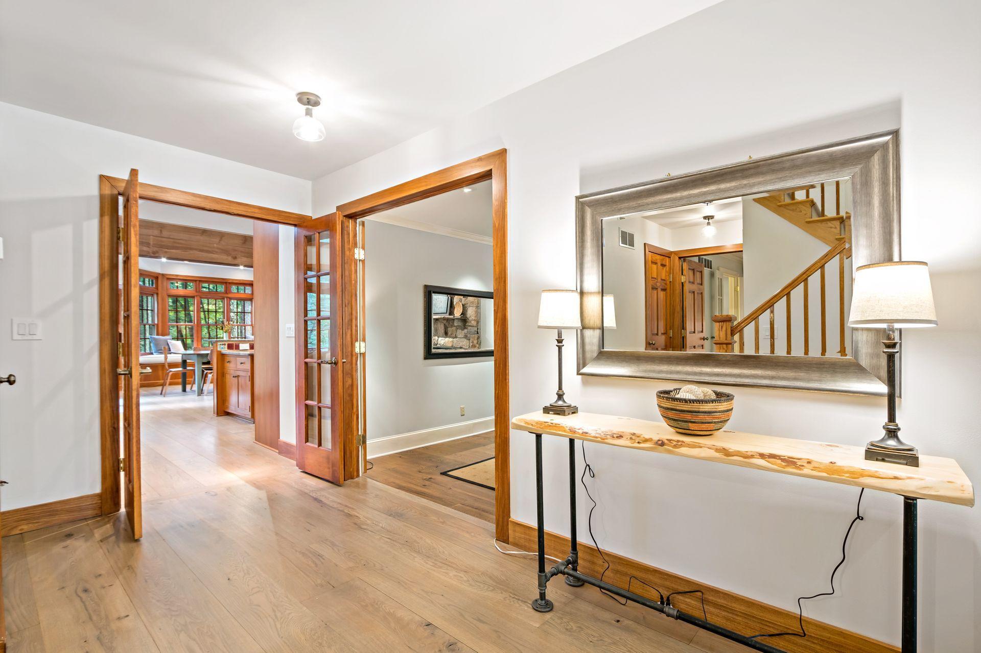111 Old Kingdom Road Wilton, CT 06897 - Photo 8 of 57 a view of a livingroom with wooden floor and a flat screen tv