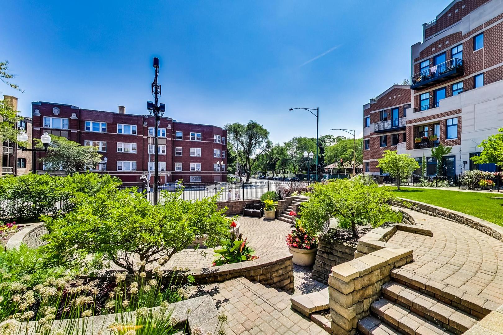 7742 North Sheridan Road, Unit 1L Chicago, IL 60626 - Photo 2 of 40 a view of a chairs and table in a patio