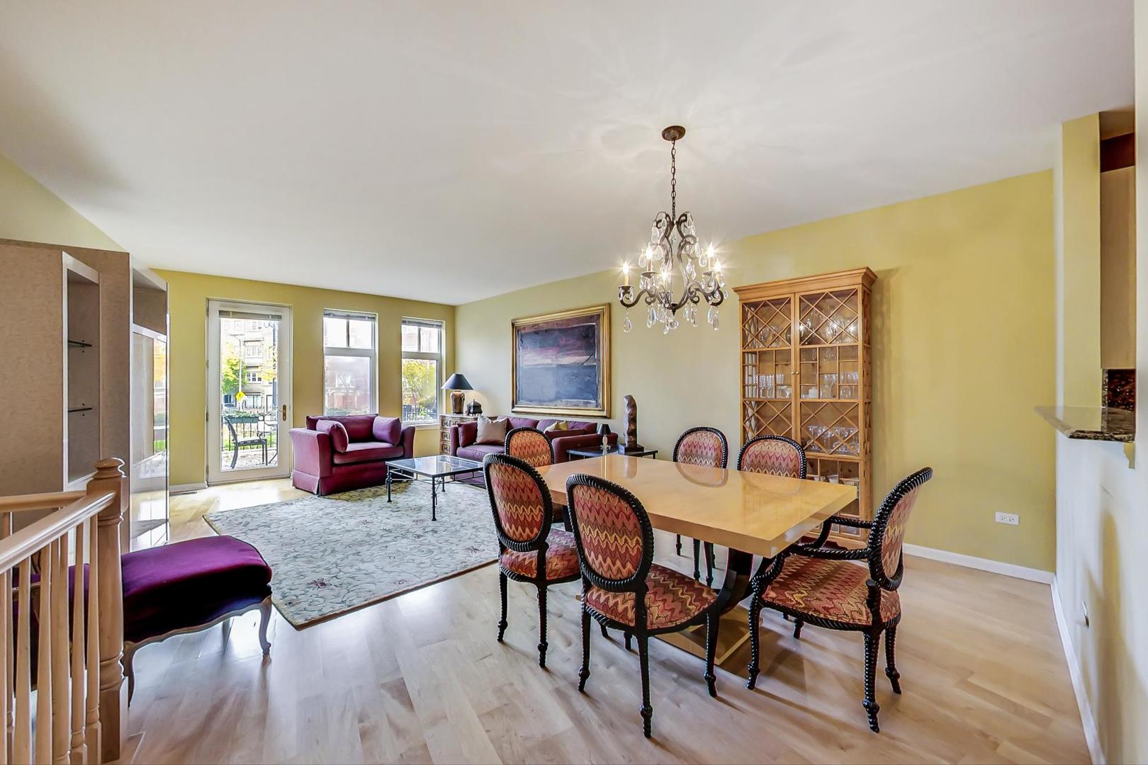 7742 North Sheridan Road, Unit 1L Chicago, IL 60626 - Photo 11 of 40 a view of a dining room with furniture window and wooden floor