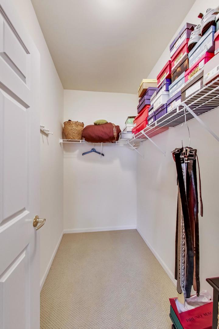 7742 North Sheridan Road, Unit 1L Chicago, IL 60626 - Photo 20 of 40 a view of walk in closet with clothes and shoes