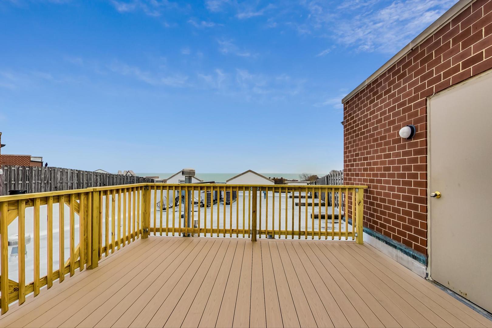 7742 North Sheridan Road, Unit 1L Chicago, IL 60626 - Photo 34 of 40 a view of wooden balcony with outdoor space