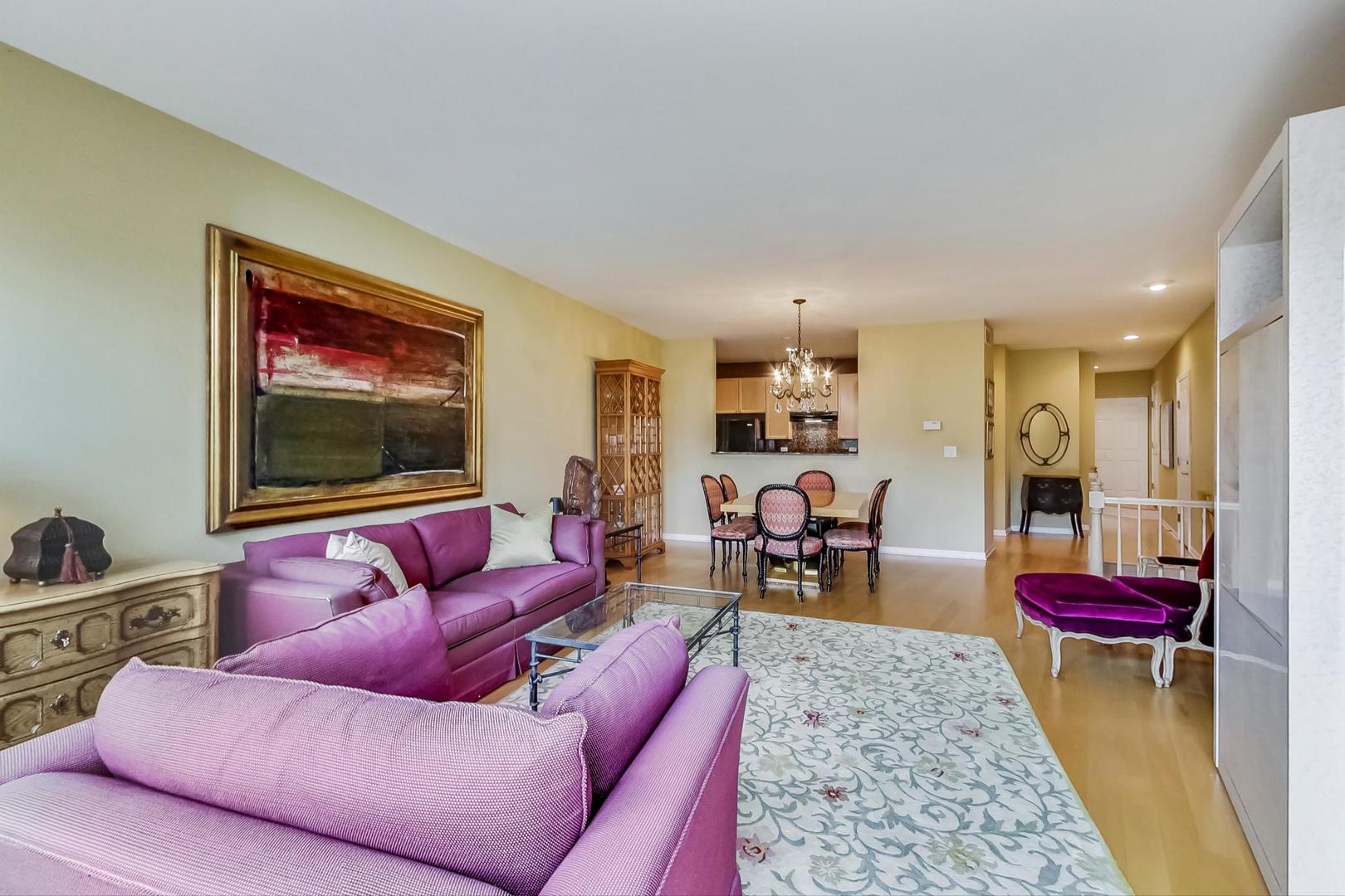 7742 North Sheridan Road, Unit 1L Chicago, IL 60626 - Photo 10 of 40 a living room with furniture and a flat screen tv