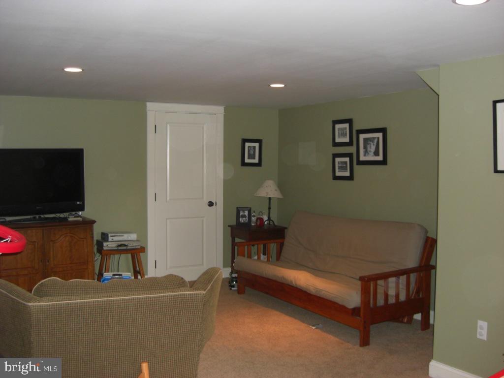 308 Front Street Lititz, PA 17543 - Photo 13 of 13 a living room with furniture and a flat screen tv