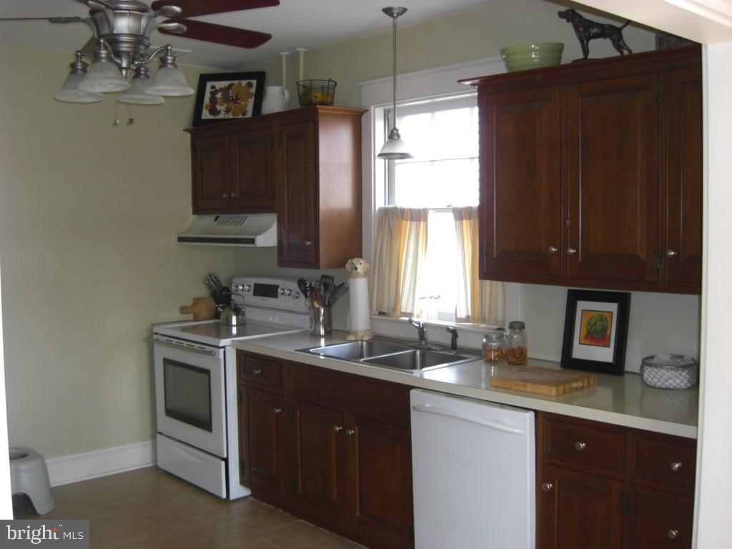 308 Front Street Lititz, PA 17543 - Photo 7 of 13 a kitchen with a sink stove and microwave