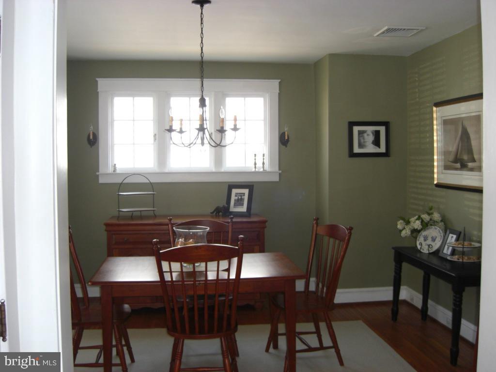 308 Front Street Lititz, PA 17543 - Photo 9 of 13 a view of a dining room with furniture window and wooden floor