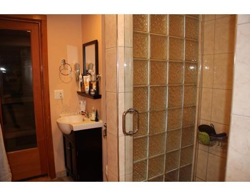 50 Mary Ellen Road Newton, MA 02468 - Photo 20 of 22 a bathroom with a sink a mirror and shower