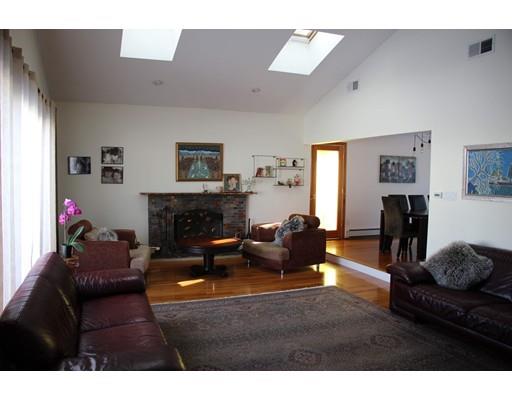 50 Mary Ellen Road Newton, MA 02468 - Photo 4 of 22 a living room with furniture a flat screen tv and a fireplace
