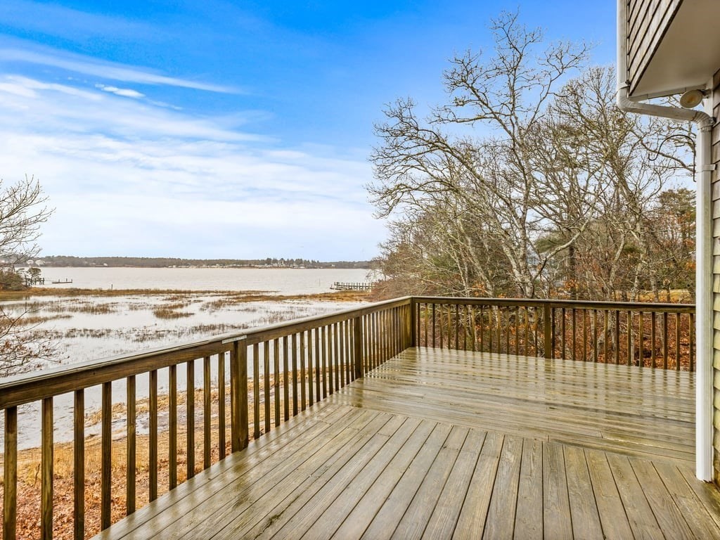 11 Wolf Road Bourne, MA 02532 - Photo 2 of 38 a view of wooden deck and a lake