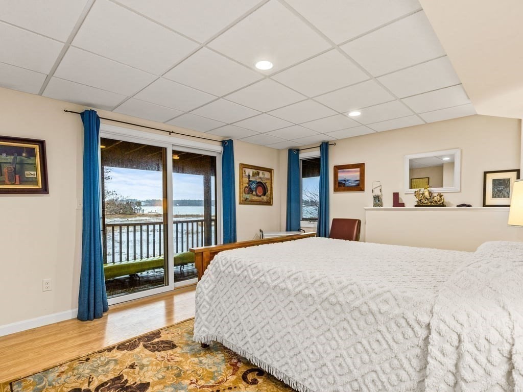 11 Wolf Road Bourne, MA 02532 - Photo 27 of 38 a spacious bedroom with a large bed and a dresser