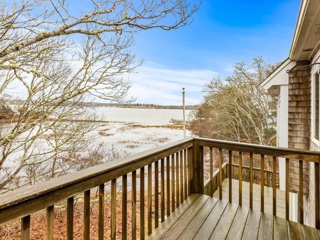 11 Wolf Road Bourne, MA 02532 - Photo 4 of 38 a view of trees and deck in the balcony