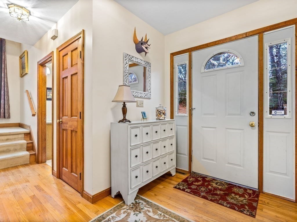 11 Wolf Road Bourne, MA 02532 - Photo 5 of 38 a view of a hallway with mirror and furniture