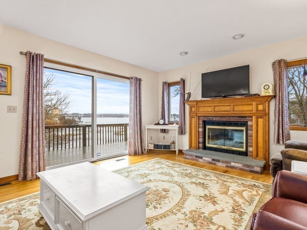 11 Wolf Road Bourne, MA 02532 - Photo 6 of 38 a living room with furniture and a fireplace