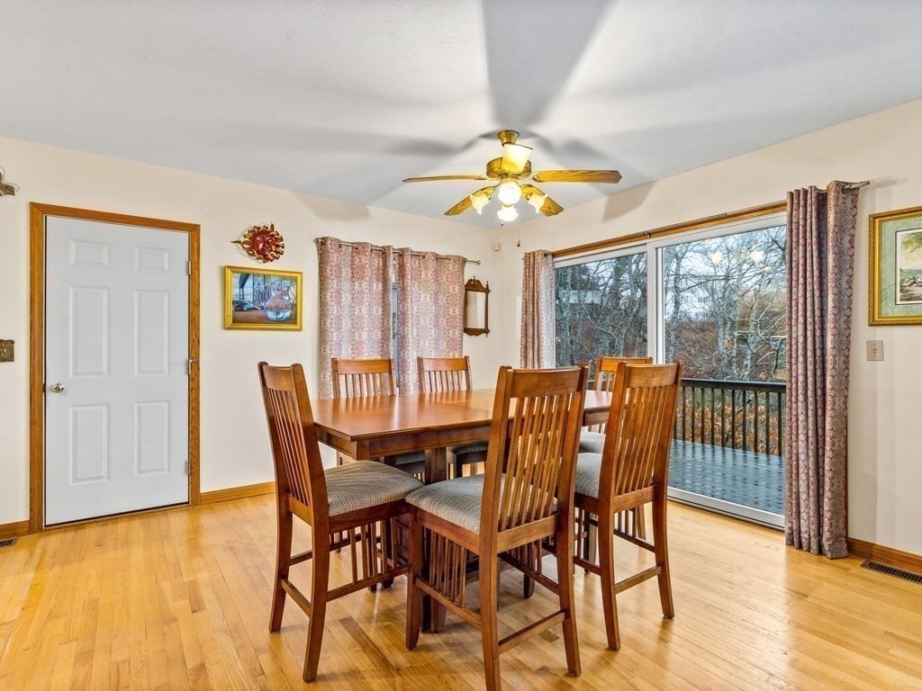 11 Wolf Road Bourne, MA 02532 - Photo 9 of 38 a view of a dining room with furniture and chandelier