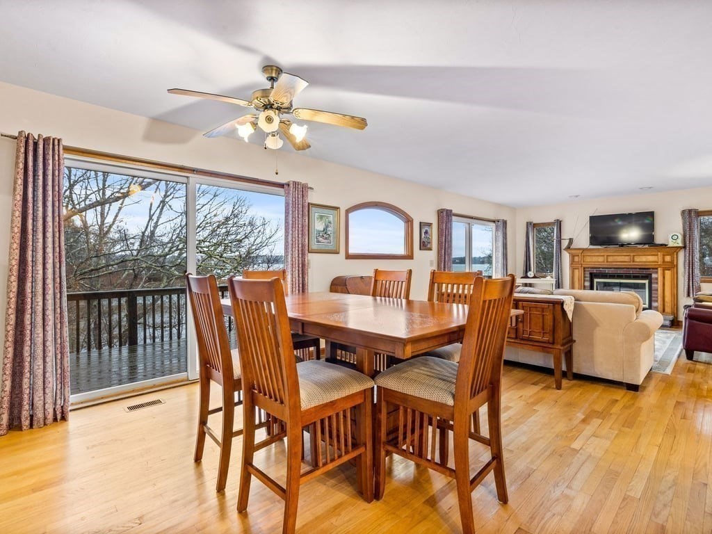 11 Wolf Road Bourne, MA 02532 - Photo 10 of 38 a view of a dining room with furniture a chandelier and wooden floor