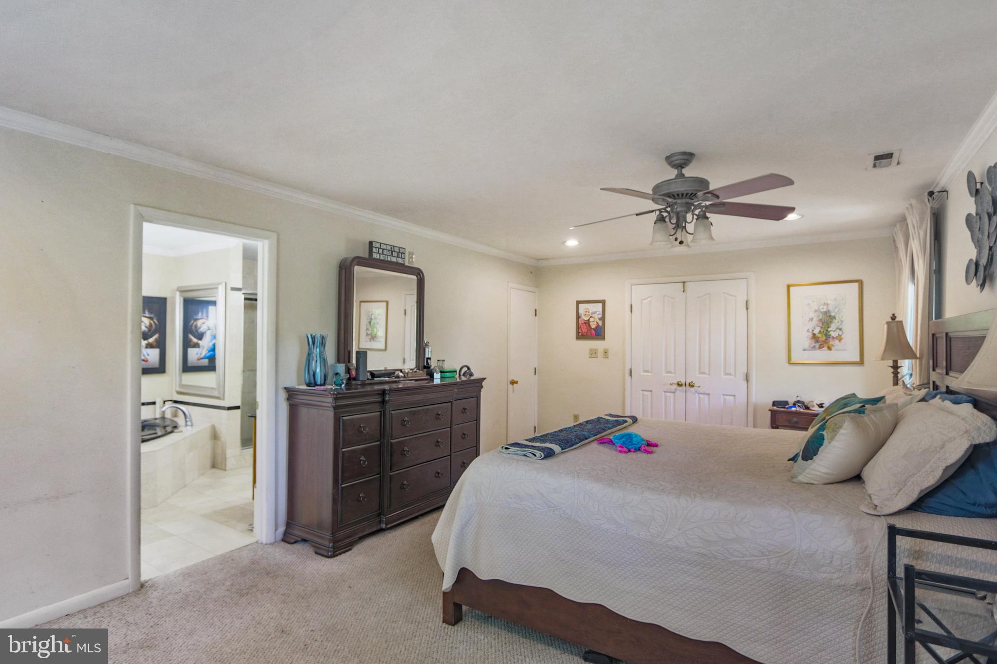 41 Wood Landing Road Fredericksburg, VA 22405 - Photo 10 of 79 a bedroom with a bed and a mirror