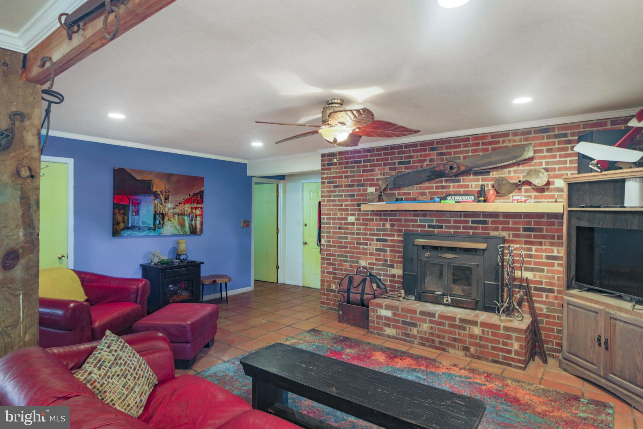 41 Wood Landing Road Fredericksburg, VA 22405 - Photo 25 of 79 a living room with furniture a flat screen tv and a fireplace