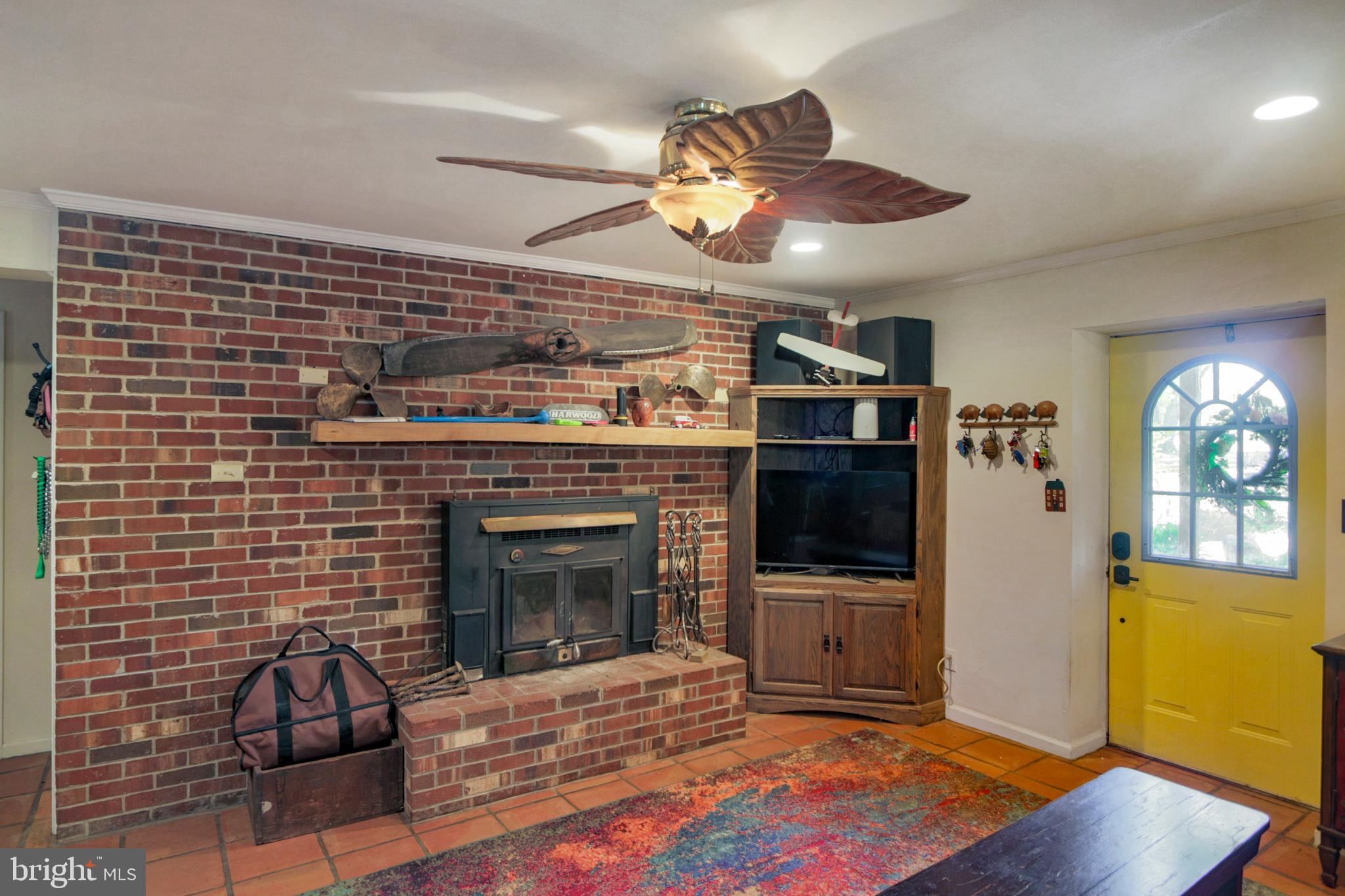 41 Wood Landing Road Fredericksburg, VA 22405 - Photo 28 of 79 a living room with furniture a flat screen tv and a fireplace