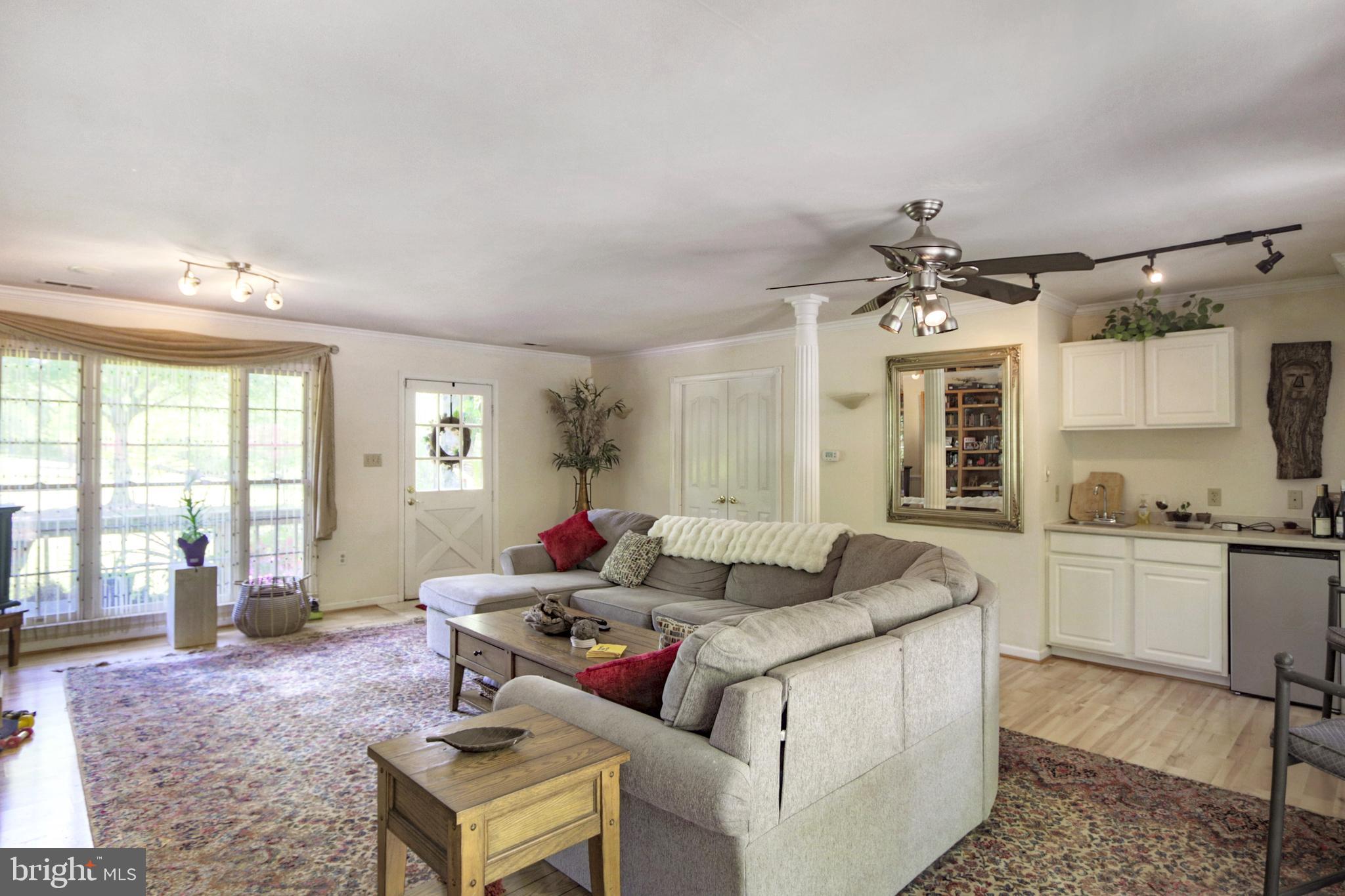 41 Wood Landing Road Fredericksburg, VA 22405 - Photo 35 of 79 a living room with furniture and a large window