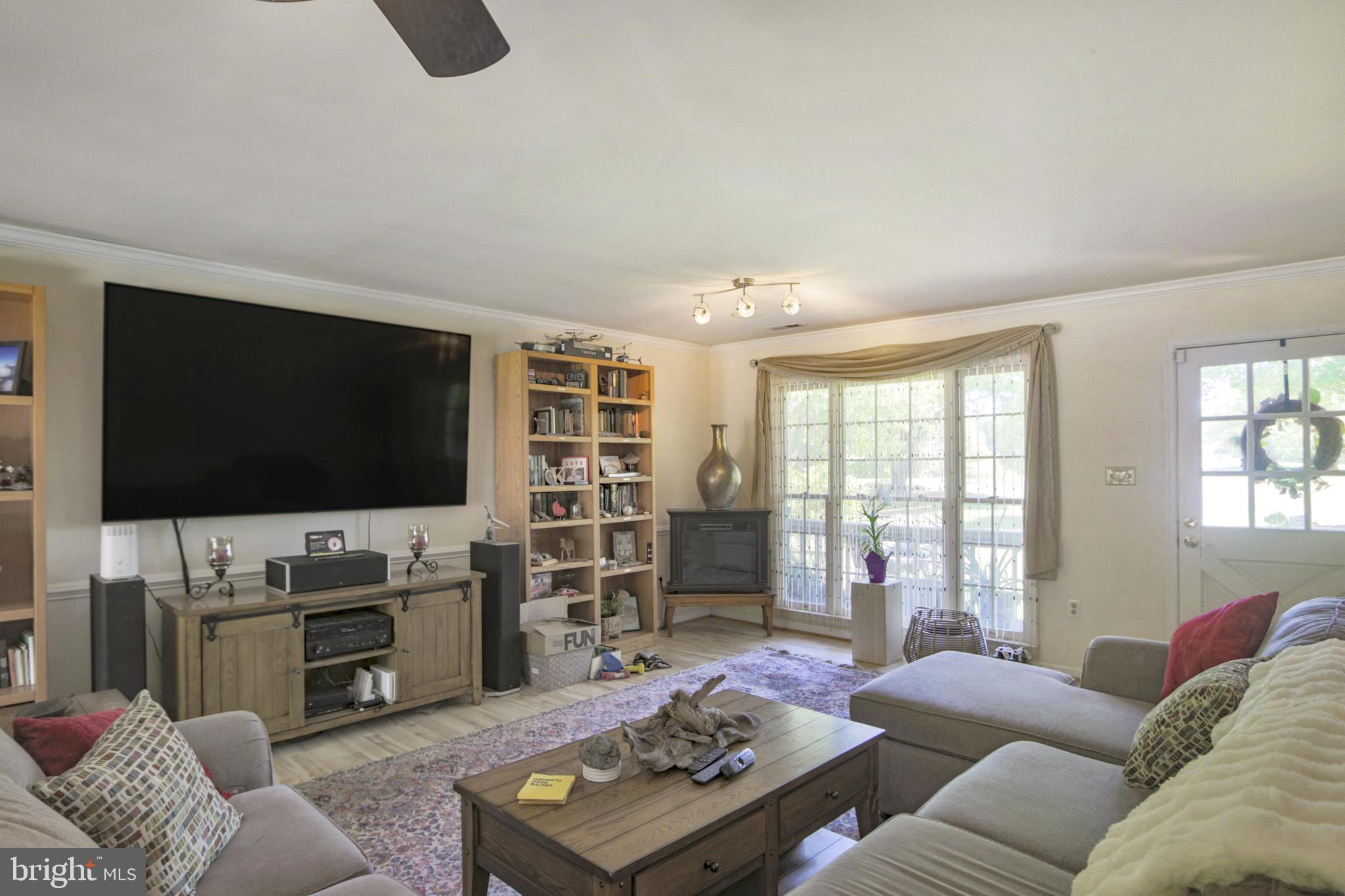 41 Wood Landing Road Fredericksburg, VA 22405 - Photo 36 of 79 a living room with furniture and a flat screen tv
