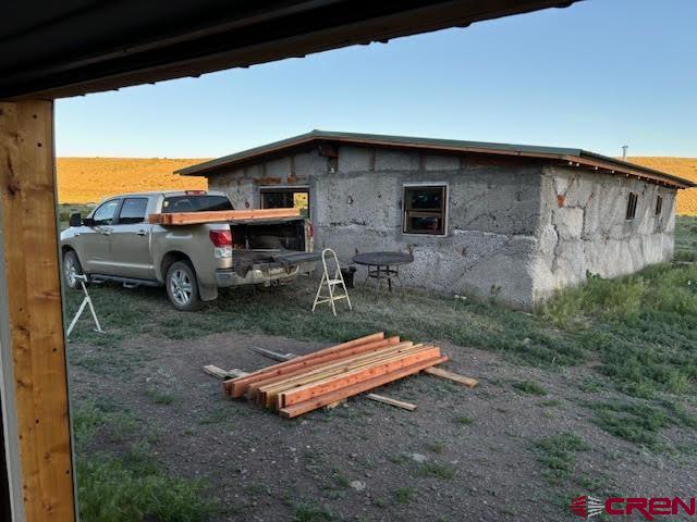 406 Canyon Road Antonito, CO 81120 - Photo 2 of 16 a backyard of a house with barbeque oven