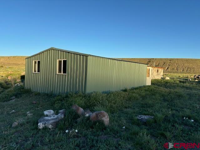 406 Canyon Road Antonito, CO 81120 - Photo 4 of 16 a view of a back yard