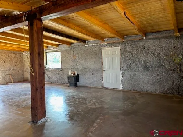 a view of a room with wooden walls