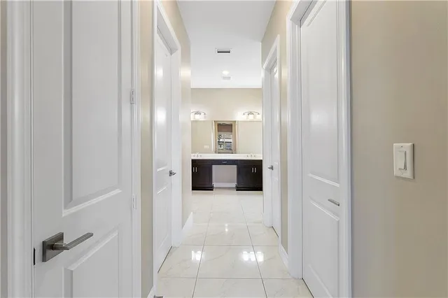 a spacious bathroom with a bathtub sink and mirror