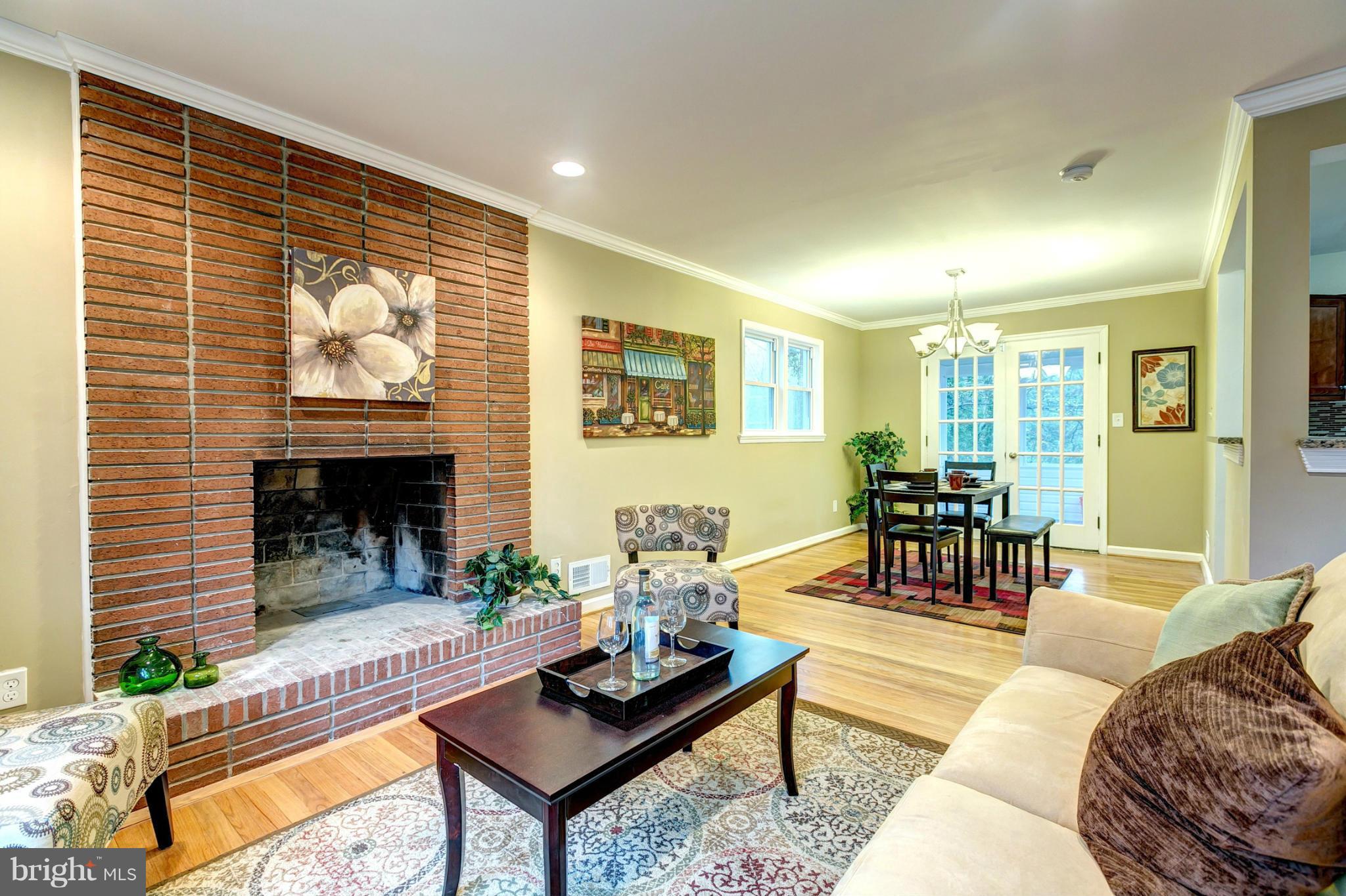 6708 Glenkirk Road Baltimore, MD 21239 - Photo 5 of 30 Gorgeous Fireplace With Exposed Brick
