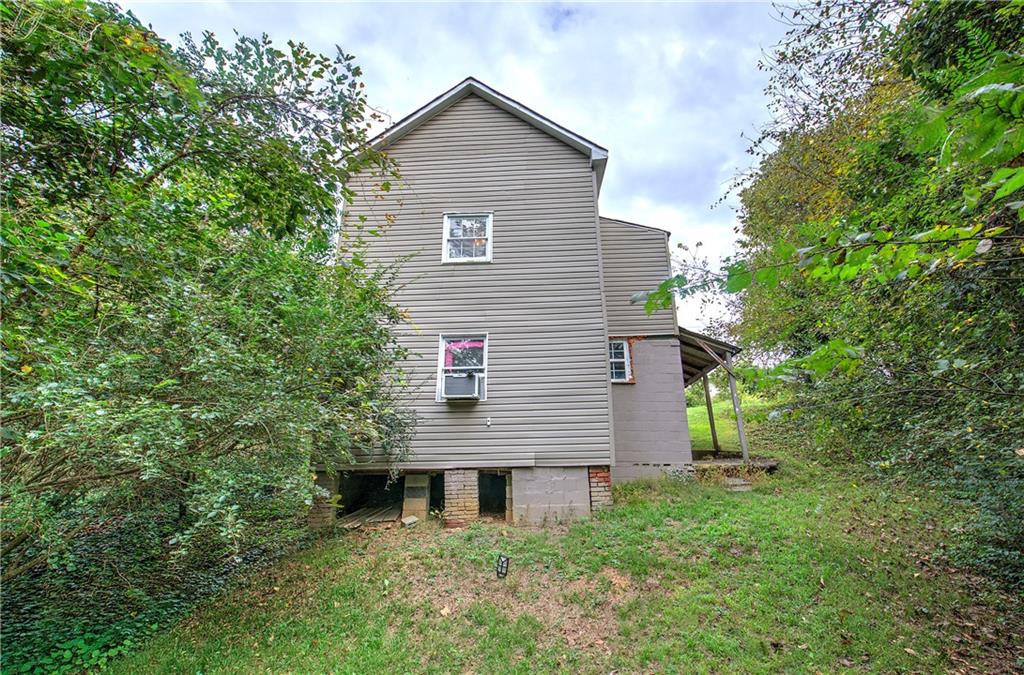 105 Mary Street Rome, GA 30161 - Photo 15 of 15 a view of a house with a yard