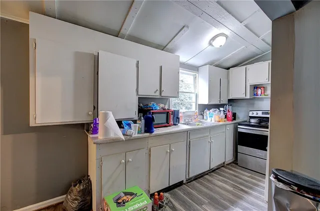 a kitchen with stainless steel appliances a sink a stove and a refrigerator