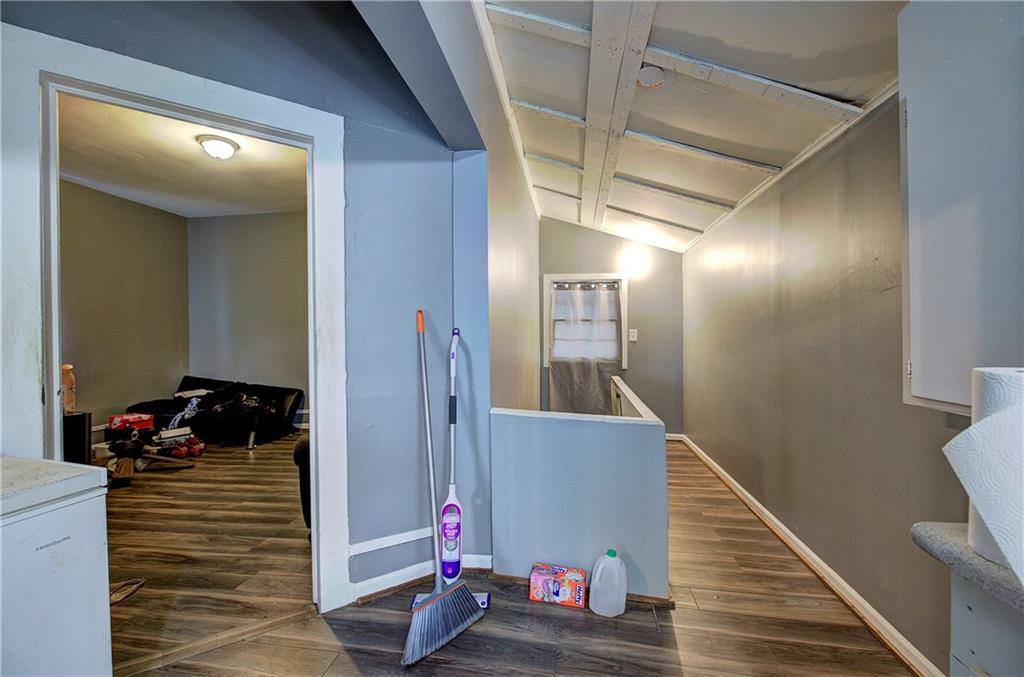 105 Mary Street Rome, GA 30161 - Photo 8 of 15 a view of a hallway with wooden floor and stairs