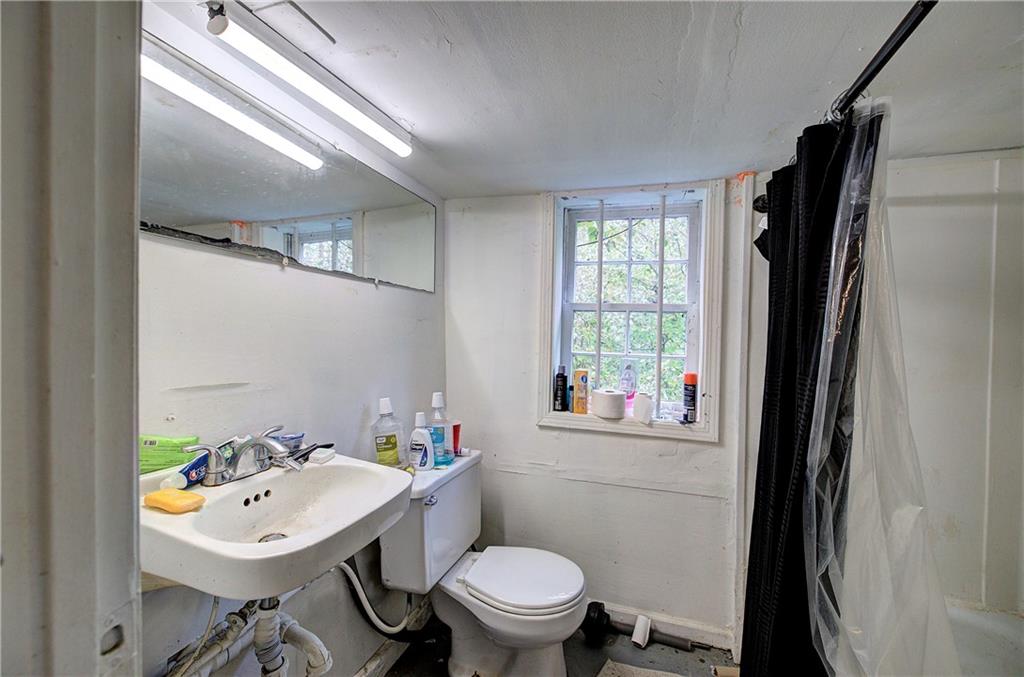 105 Mary Street Rome, GA 30161 - Photo 10 of 15 a bathroom with a sink toilet and a mirror