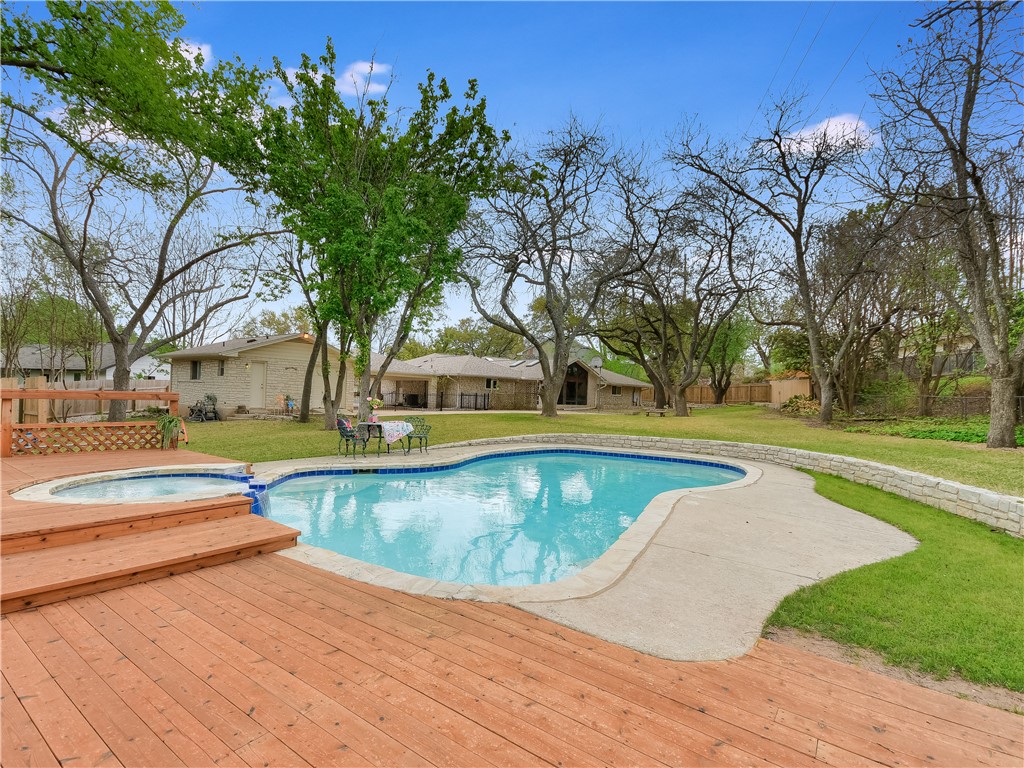 a view of swimming pool with trees