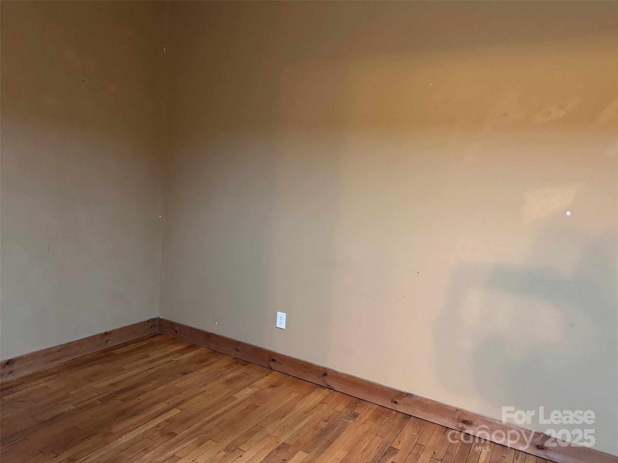 110 Church Street Northwest Lenoir, NC 28645 - Photo 11 of 11 a view of empty room with wooden floor