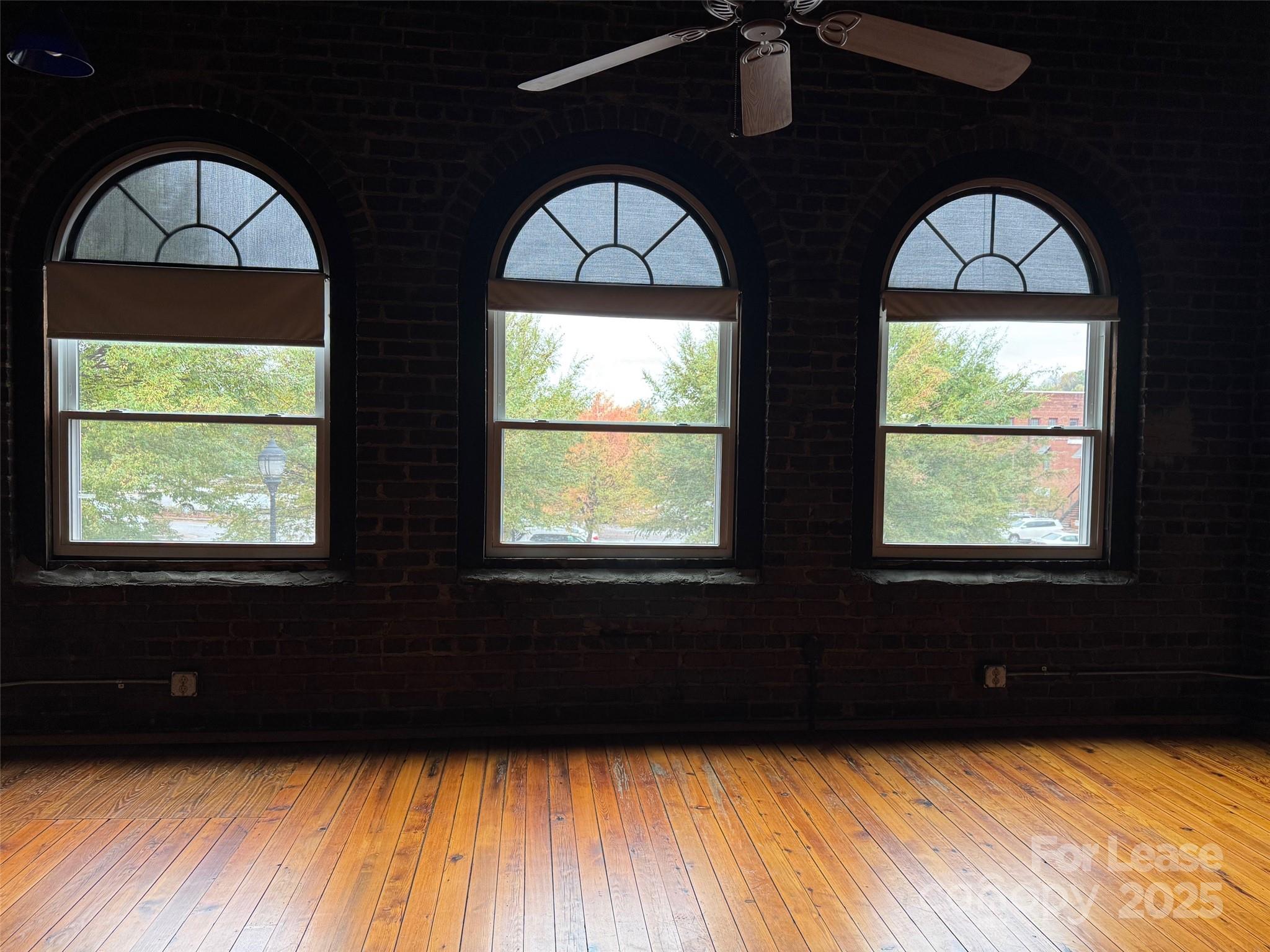 110 Church Street Northwest Lenoir, NC 28645 - Photo 4 of 11 a view of wooden floor and windows in a room