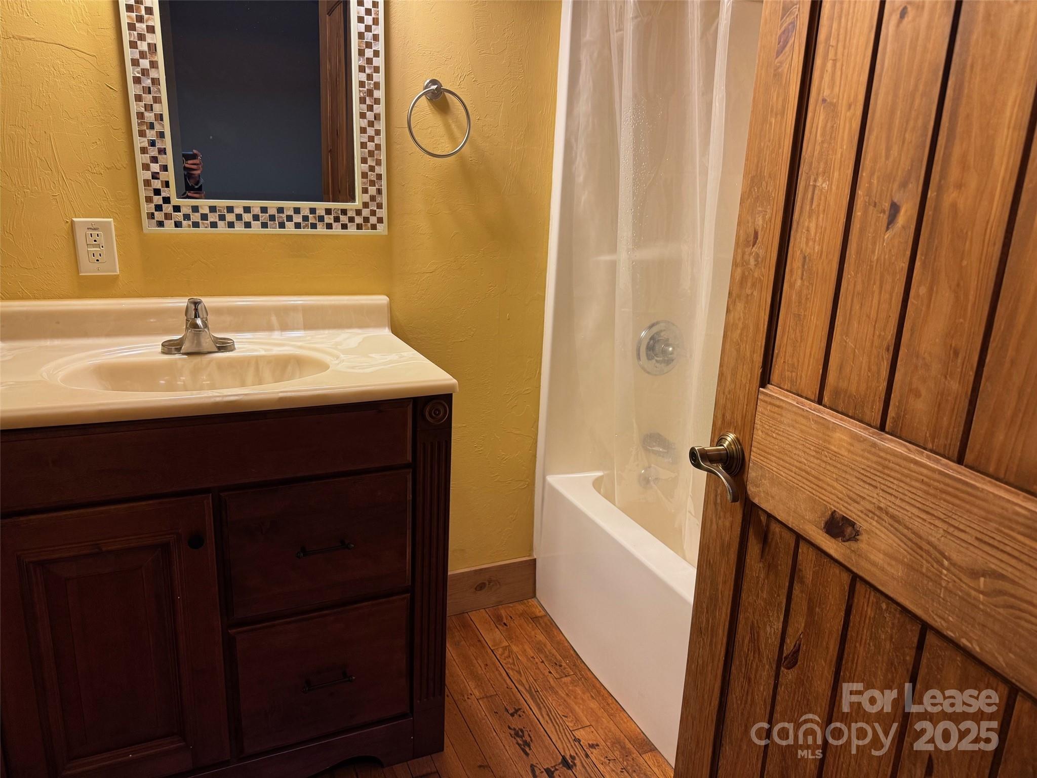 110 Church Street Northwest Lenoir, NC 28645 - Photo 10 of 11 a bathroom with a sink and a bathtub