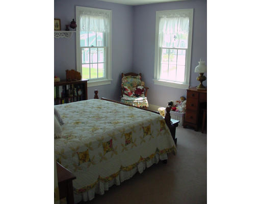 12 Beech Tree Farm Road Scituate, MA 02066 - Photo 17 of 24 a bed sitting in a bedroom next to a window